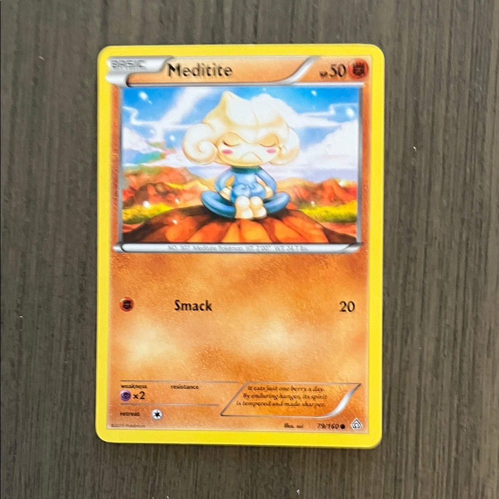 Pokemon Meditite Trading Card - Yellow and Orange